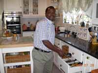 Houseman arranging big cutlery drawer